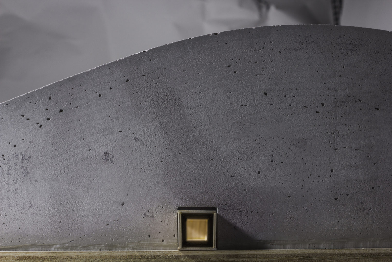 LIGHT FROM ATRIUM BECKONS VISITORS FORWARD THROUGH TUNNEL DURING FINAL MOMENTS OF HIKING APPROACH